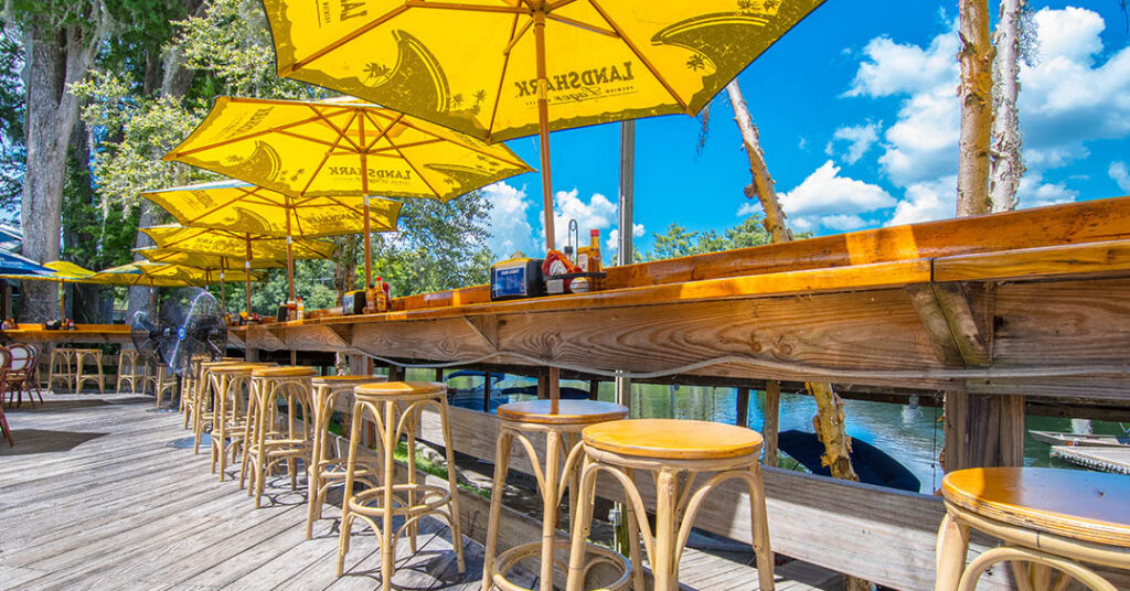 the blue gator seating over the river